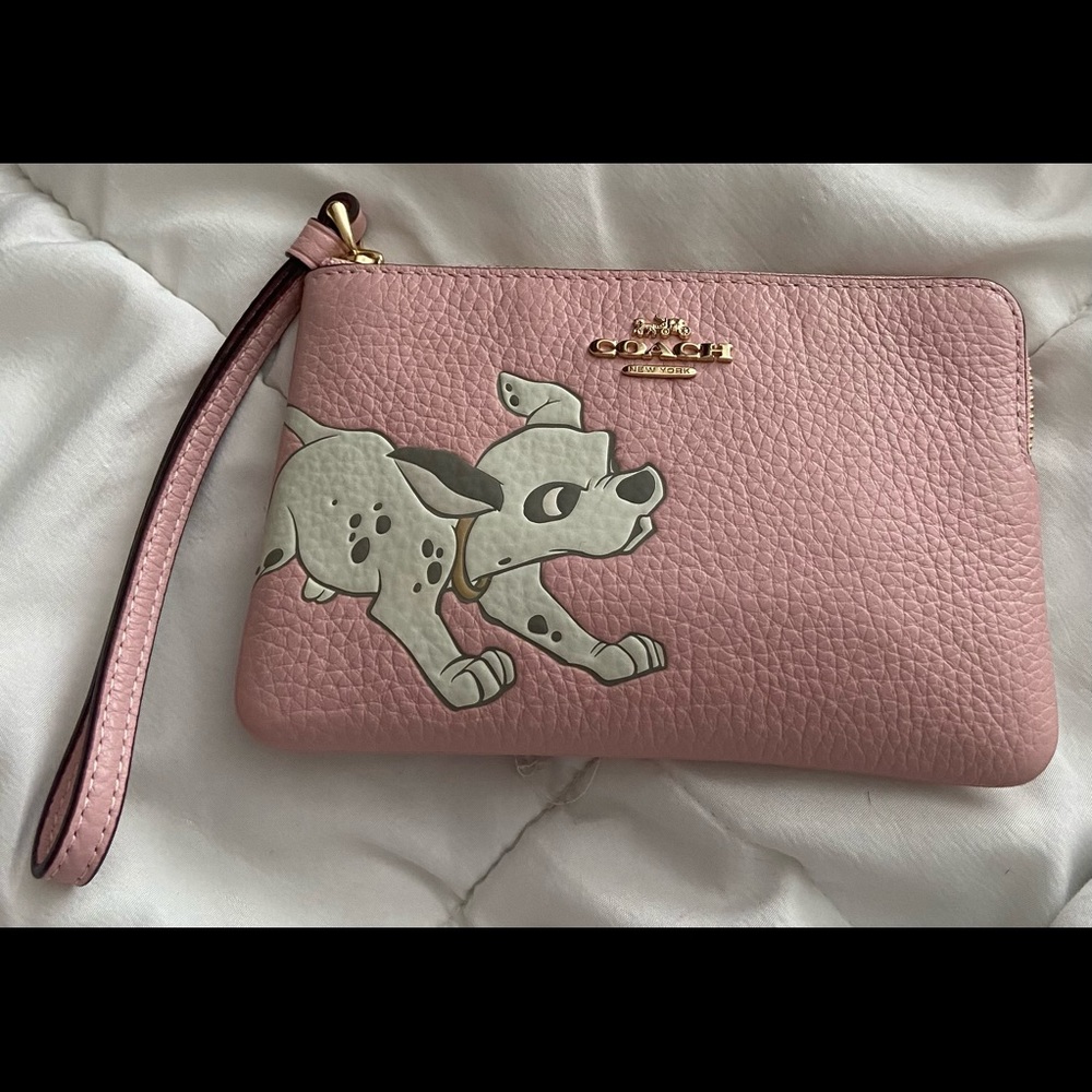 Slightly used Coach Disney Dalmations wristlet.